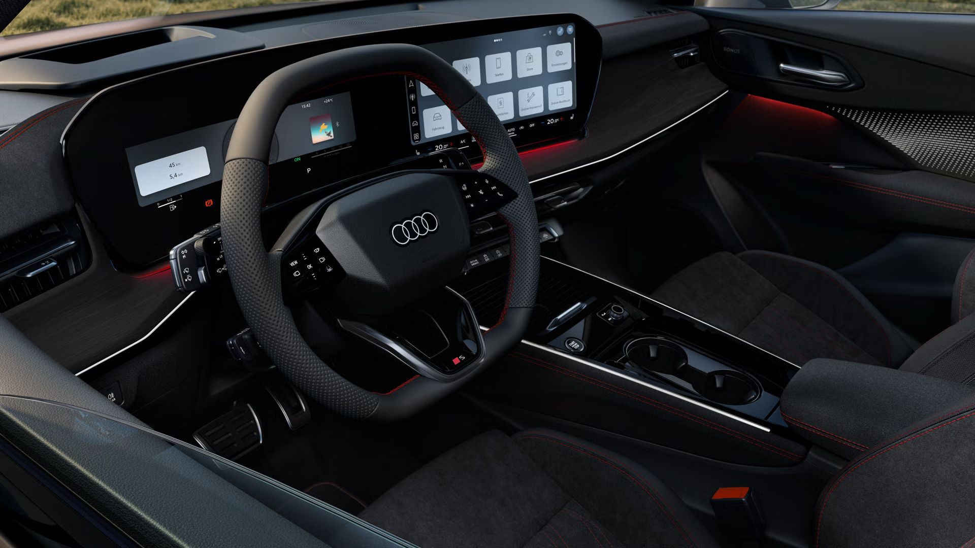 Blick von vorne auf das Lenkrad, Mittelkonsole und digitale Displays im Audi Q3 Sportback