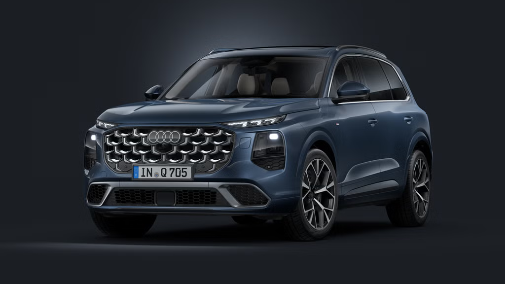 Schräge Frontansicht des Audi Q7 SUV auf dunklem Hintergrund.